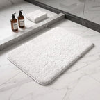 White plush bath rug showing its rectangular shape