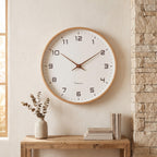 Clean white dial and slim markers on the wooden wall clock