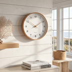 Nordic wooden wall clock hanging in a modern living room