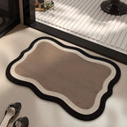 Mocha absorbent diatom mud bath mat, mocha centre with a cream band and dark edge, on a bathroom floor