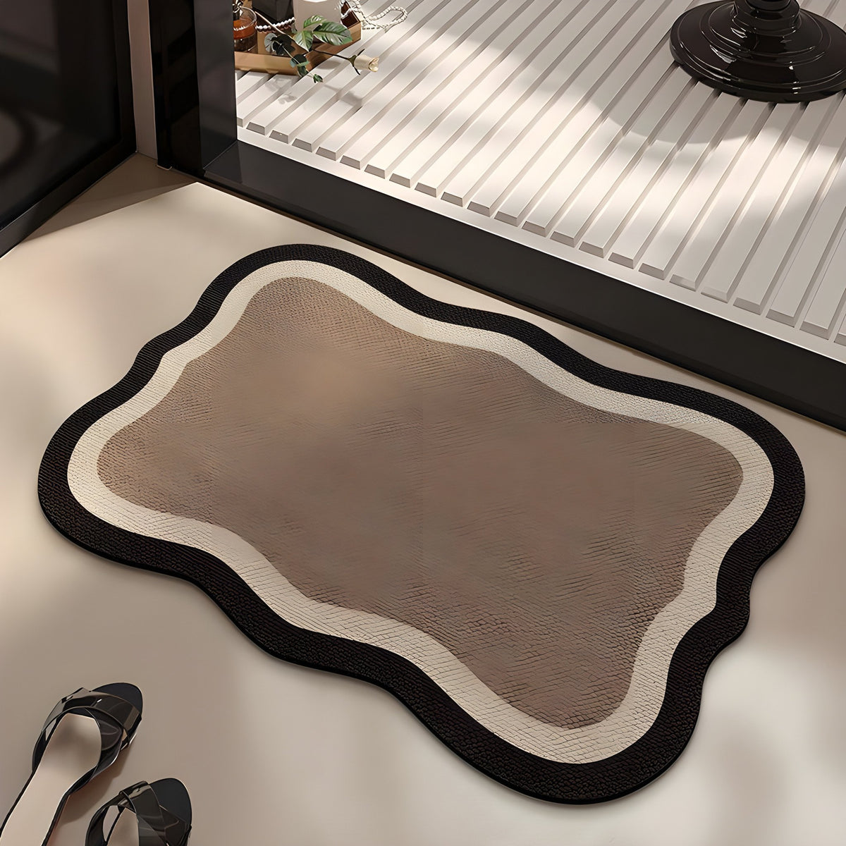 Mocha absorbent diatom mud bath mat, mocha centre with a cream band and dark edge, on a bathroom floor