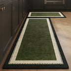 Forest Frame absorbent kitchen mat, forest green centre with a black frame, on a timber floor