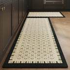 Ivory Cross absorbent kitchen mat, ivory with a small cross pattern and black edge, on a timber floor