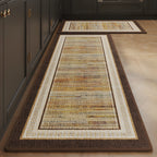 Amber Stripe absorbent kitchen mat, amber and rust stripes with a brown edge, on a timber floor