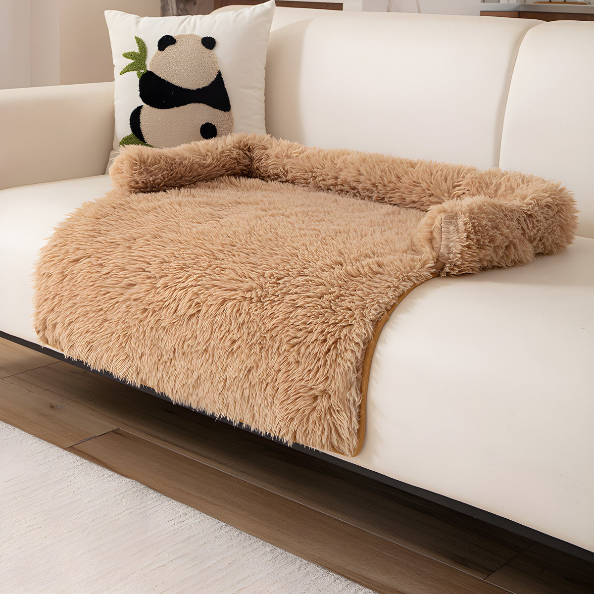 Camel fluffy nest pet sofa mat on a cream sofa
