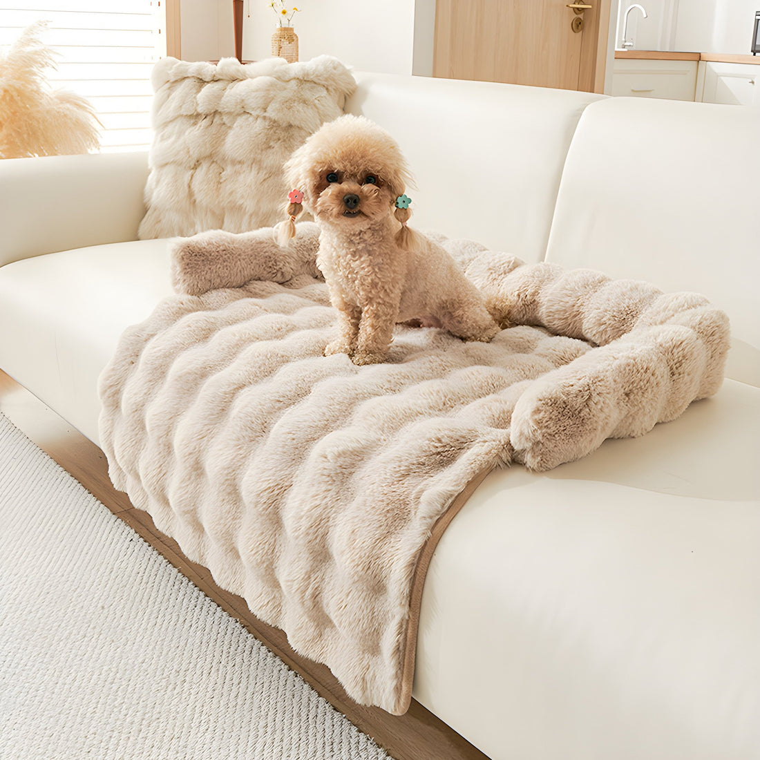 Mocha plush faux fur pet sofa mat on a cream sofa with a small dog sitting on it