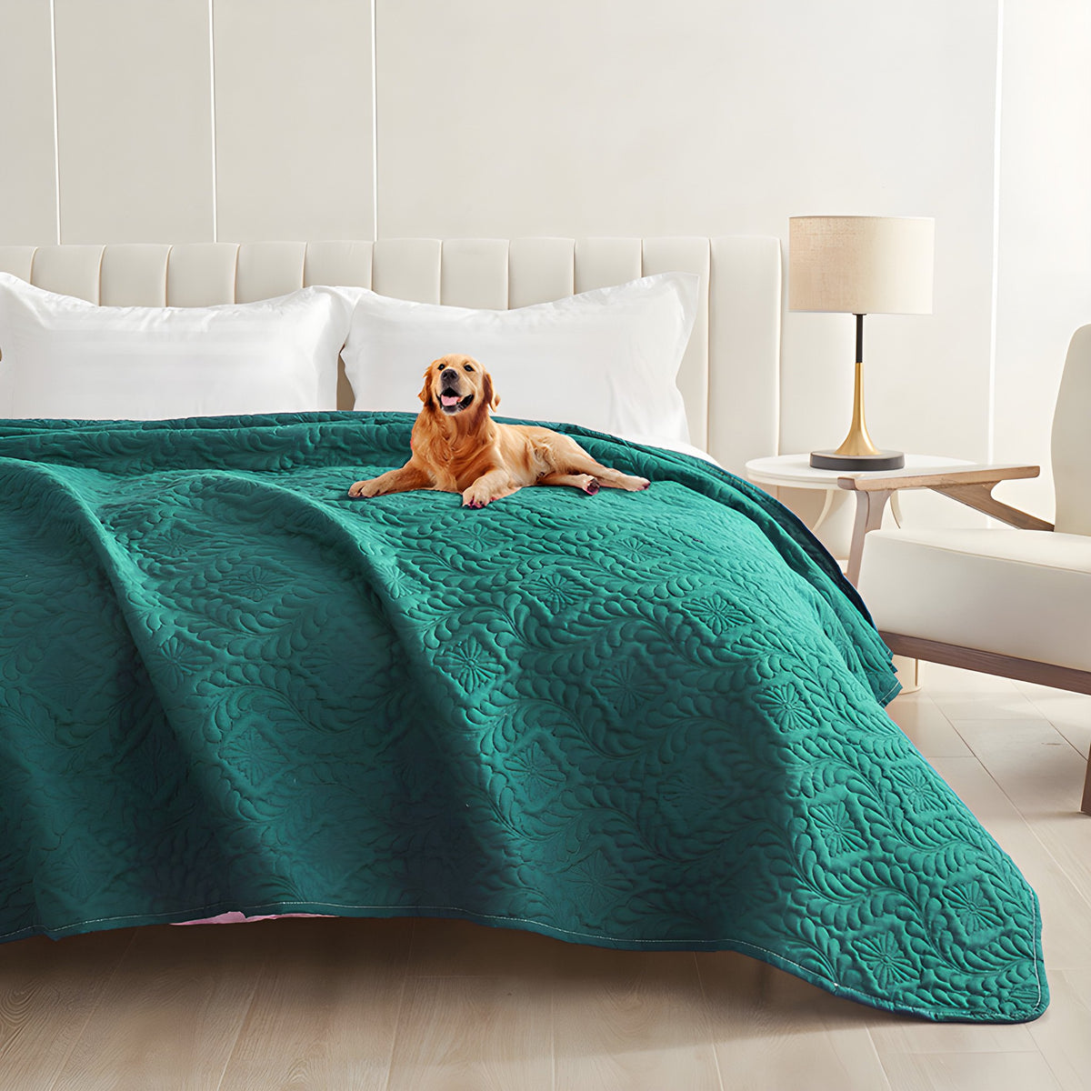 Emerald green quilted waterproof bed cover on a bed with a golden retriever lying on top